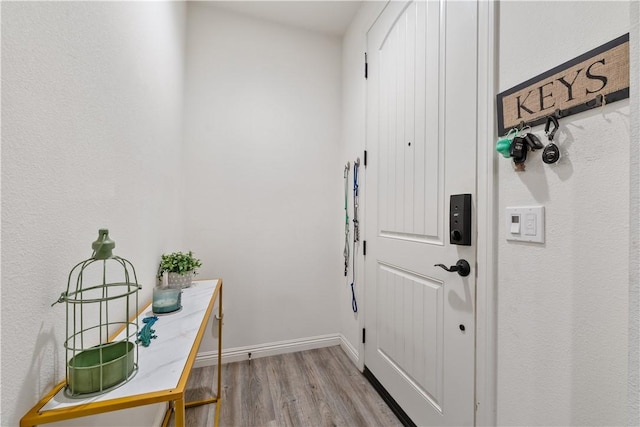 2848 E Berry Loop Privado Unit 52, Ontario, CA 91761 - doorway to outside with wood finished floors and baseboards