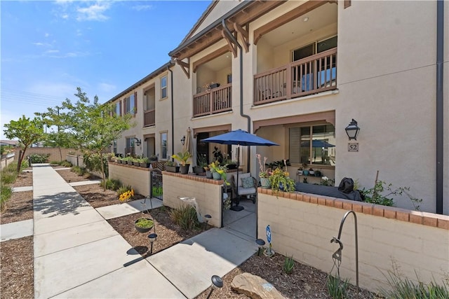 2848 E Berry Loop Privado Unit 52, Ontario, CA 91761 - view of building exterior featuring a fenced front yard