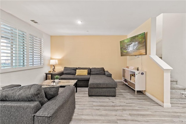 2848 E Berry Loop Privado Unit 52, Ontario, CA 91761 - living room featuring light wood finished floors and stairway