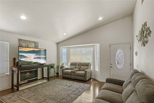 15460 Guava Way, Victorville, CA 92394 - living room featuring lofted ceiling, wood finished floors, recessed lighting, and a tiled fireplace