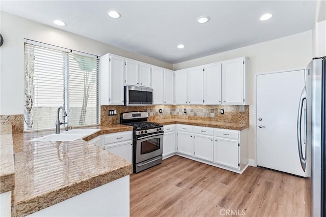 4441 Foxrun Dr, Chino Hills, CA 91709 - kitchen featuring appliances with stainless steel finishes, light wood-type flooring, white cabinets, and recessed lighting
