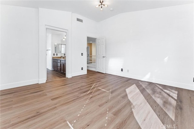 4441 Foxrun Dr, Chino Hills, CA 91709 - unfurnished bedroom featuring light wood-style flooring, connected bathroom, and vaulted ceiling