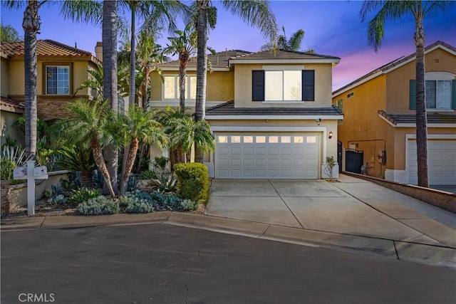 4441 Foxrun Dr, Chino Hills, CA 91709 - view of front of house with stucco siding, concrete driveway, a garage, and a tiled roof