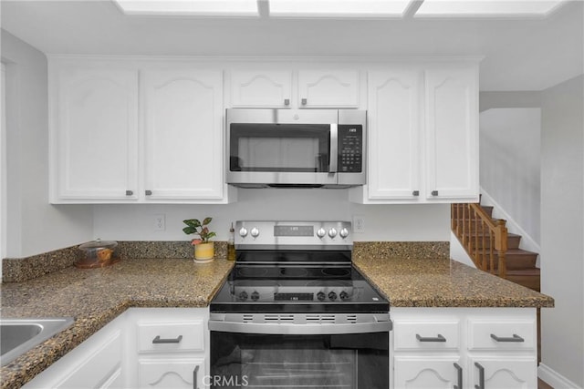 373 N Via Remo, Anaheim, CA 92806 - kitchen with appliances with stainless steel finishes, white cabinets, and dark stone countertops