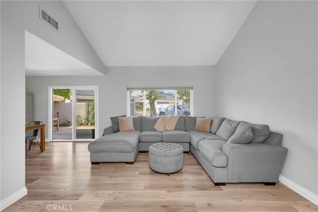 373 N Via Remo, Anaheim, CA 92806 - living room featuring healthy amount of natural light, light wood-style floors, and high vaulted ceiling
