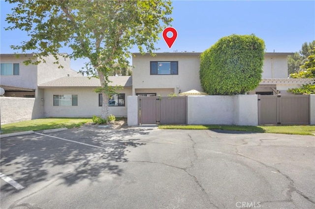 373 N Via Remo, Anaheim, CA 92806 - view of front of house with a gate, uncovered parking, and stucco siding