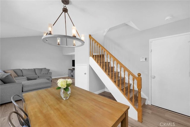 373 N Via Remo, Anaheim, CA 92806 - dining space with wood finished floors, a chandelier, and stairway