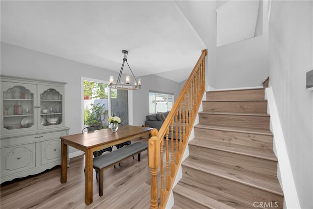 373 N Via Remo, Anaheim, CA 92806 - dining area with stairway, a chandelier, and light wood-type flooring