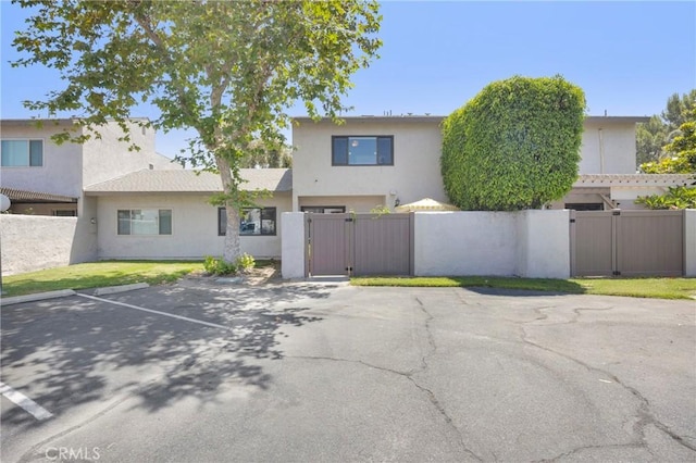 373 N Via Remo, Anaheim, CA 92806 - view of front of home featuring a gate, uncovered parking, and stucco siding