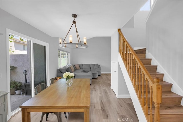 373 N Via Remo, Anaheim, CA 92806 - dining room with stairs, a chandelier, and light wood-style floors