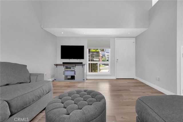 373 N Via Remo, Anaheim, CA 92806 - living area featuring wood finished floors, a towering ceiling, and recessed lighting