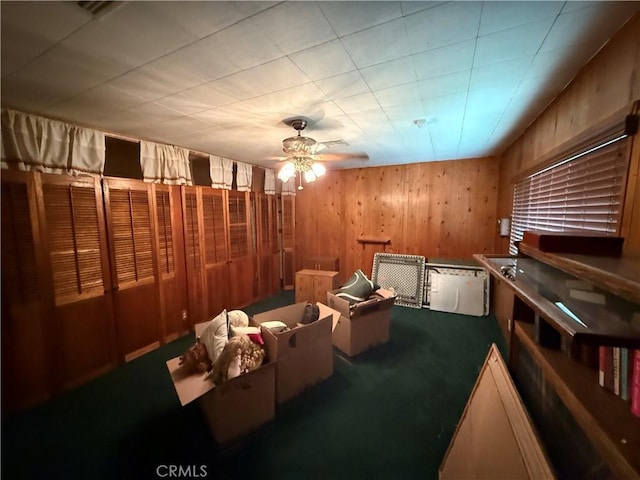 4271 Hines Ave, Riverside, CA 92505 - carpeted cinema featuring wood walls and a ceiling fan