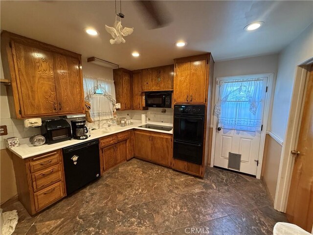 4271 Hines Ave, Riverside, CA 92505 - kitchen with black appliances, brown cabinets, backsplash, light countertops, and recessed lighting