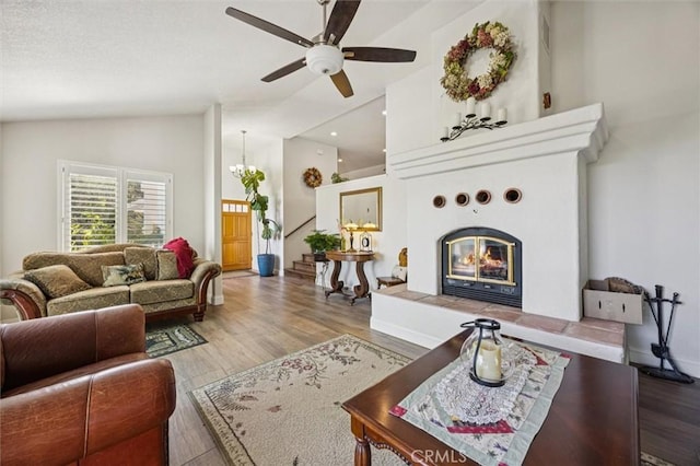 9230 Las Lomas Ave, Atascadero, CA 93422 - living room featuring ceiling fan, wood finished floors, high vaulted ceiling, a tiled fireplace, and recessed lighting
