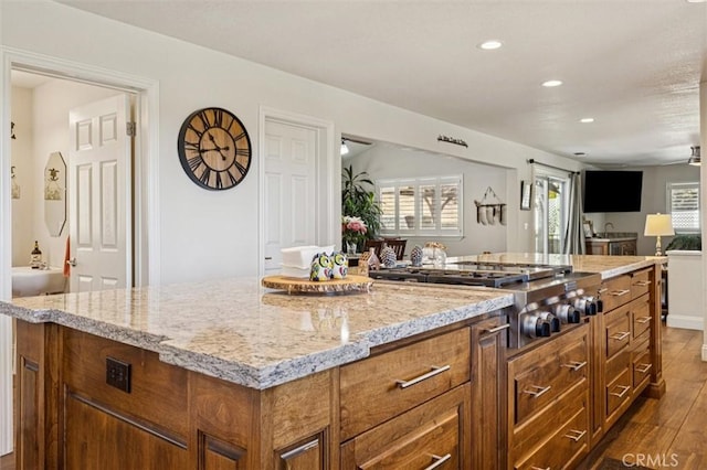 9230 Las Lomas Ave, Atascadero, CA 93422 - kitchen featuring open floor plan, dark wood finished floors, brown cabinets, stainless steel gas cooktop, and recessed lighting
