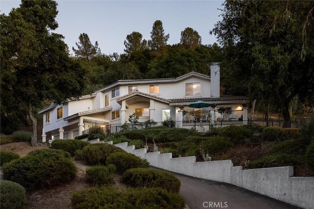 9230 Las Lomas Ave, Atascadero, CA 93422 - view of front of home featuring a chimney and stucco siding
