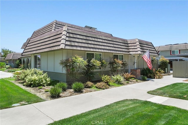 4783 Larwin Ave, Cypress, CA 90630 - view of front of home with mansard roof and a front yard