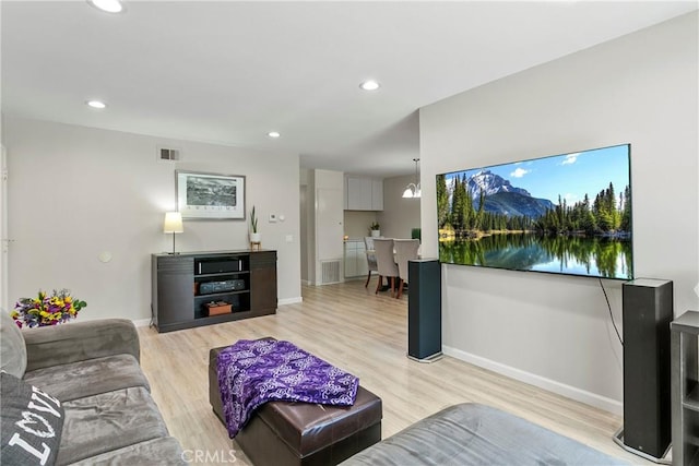 4783 Larwin Ave, Cypress, CA 90630 - living room featuring light wood-type flooring and recessed lighting