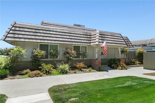 4783 Larwin Ave, Cypress, CA 90630 - view of front of house with mansard roof and stucco siding