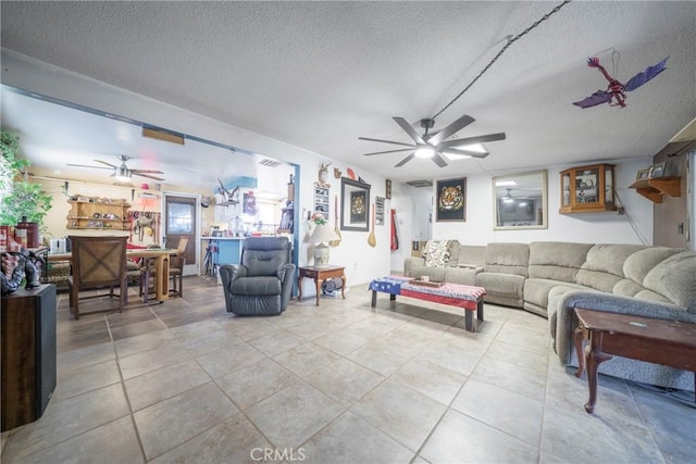 61497 Valley View Dr, Joshua Tree, CA 92252 - living area featuring a ceiling fan, a textured ceiling, and tile patterned floors