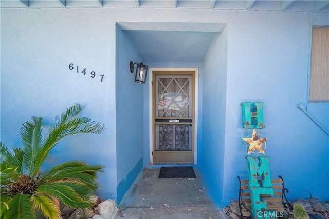 61497 Valley View Dr, Joshua Tree, CA 92252 - view of exterior entry with stucco siding