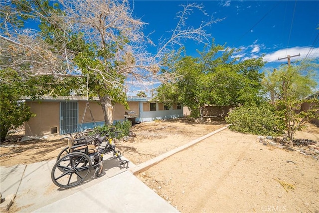 61497 Valley View Dr, Joshua Tree, CA 92252 - back of property with stucco siding