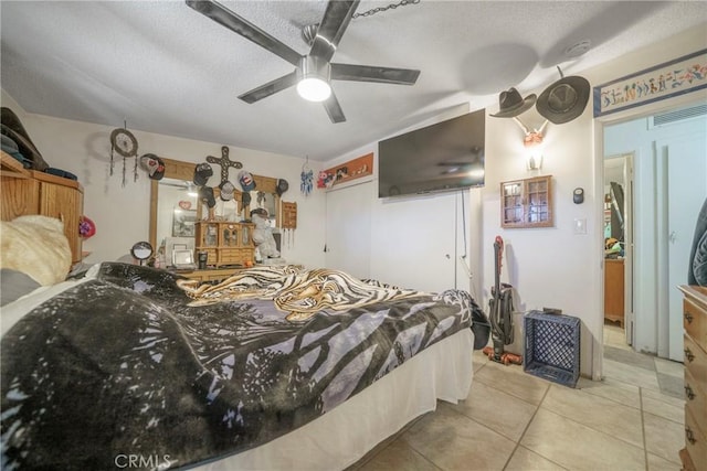 61497 Valley View Dr, Joshua Tree, CA 92252 - bedroom featuring light tile patterned flooring, a textured ceiling, and a ceiling fan