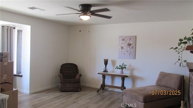 19824 Yucca Loma Rd, Apple Valley, CA 92307 - sitting room with a ceiling fan and wood finished floors