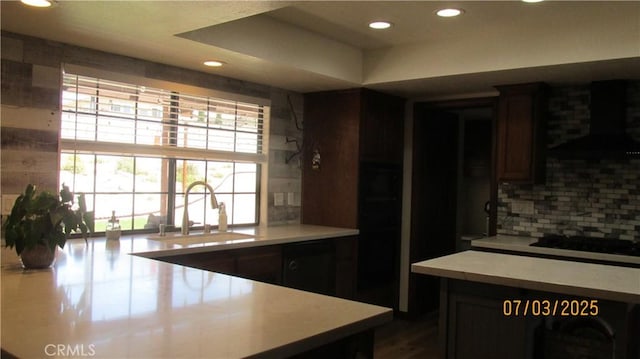 19824 Yucca Loma Rd, Apple Valley, CA 92307 - kitchen with ventilation hood, backsplash, recessed lighting, light countertops, and black electric stovetop