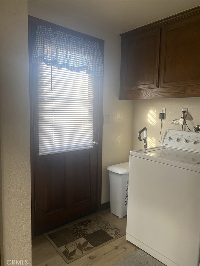 19824 Yucca Loma Rd, Apple Valley, CA 92307 - washroom featuring washer / clothes dryer, cabinet space, and light wood-type flooring