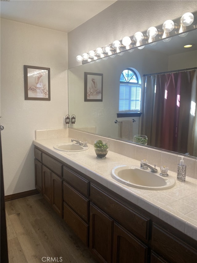 19824 Yucca Loma Rd, Apple Valley, CA 92307 - bathroom featuring wood finished floors and double vanity
