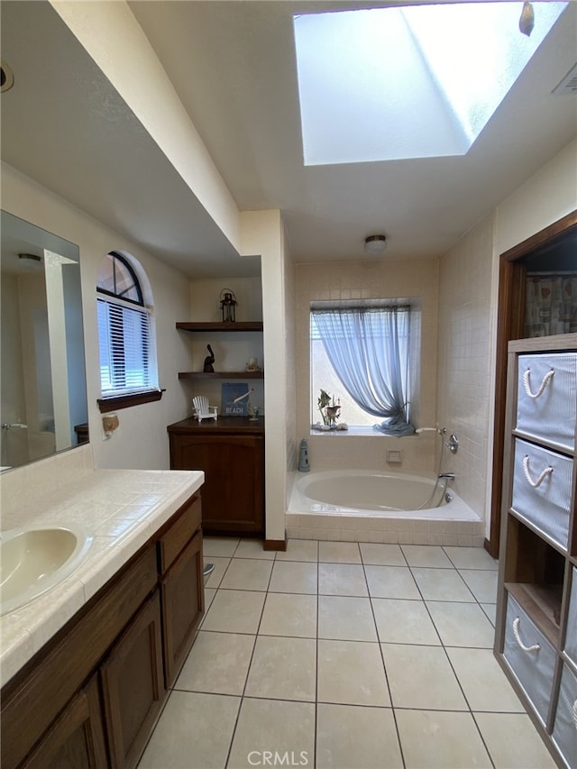 19824 Yucca Loma Rd, Apple Valley, CA 92307 - bathroom with a skylight, a garden tub, vanity, and plenty of natural light
