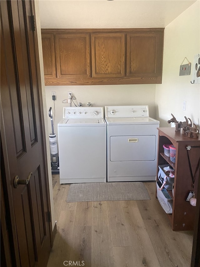 19824 Yucca Loma Rd, Apple Valley, CA 92307 - laundry area with cabinet space, separate washer and dryer, and wood finished floors