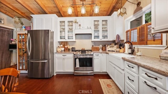 25086 Boa Dr, Crestline, CA 92325 - kitchen featuring appliances with stainless steel finishes, a wood ceiling with exposed beams, dark wood-style flooring, white cabinets, and light stone countertops