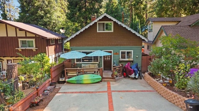25086 Boa Dr, Crestline, CA 92325 - rear view of property with a chimney, a patio, and a wooden deck