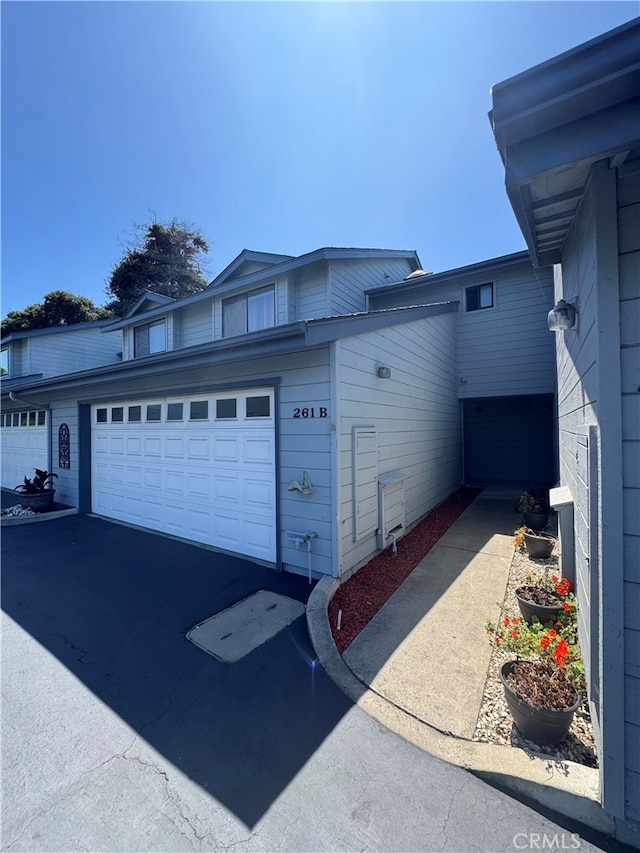261 Spruce St Unit B, Arroyo Grande, CA 93420 - view of side of property with driveway and a garage