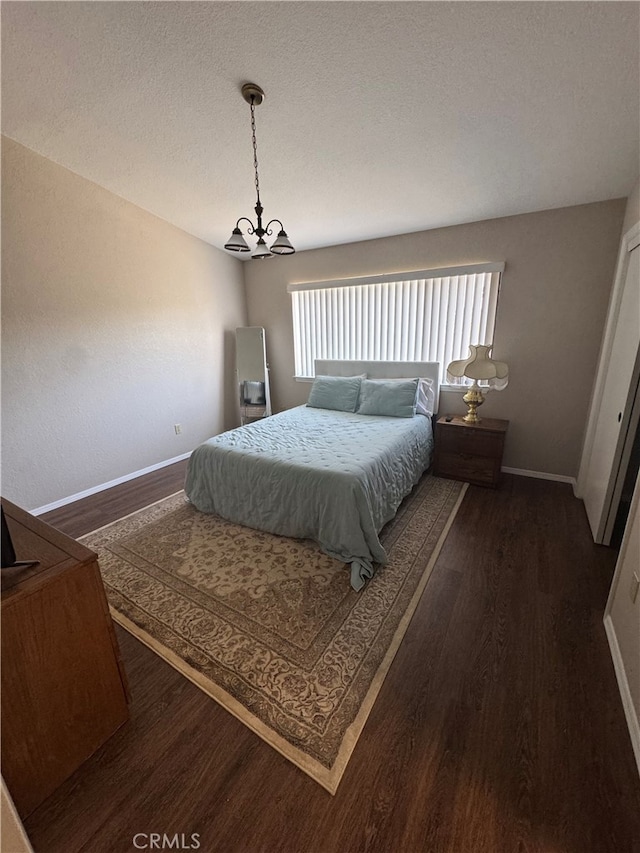261 Spruce St Unit B, Arroyo Grande, CA 93420 - bedroom featuring dark wood-style floors, a chandelier, and a textured ceiling