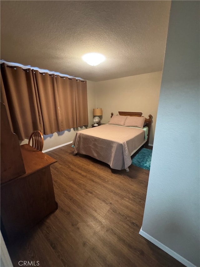 261 Spruce St Unit B, Arroyo Grande, CA 93420 - bedroom with a textured ceiling and dark wood finished floors