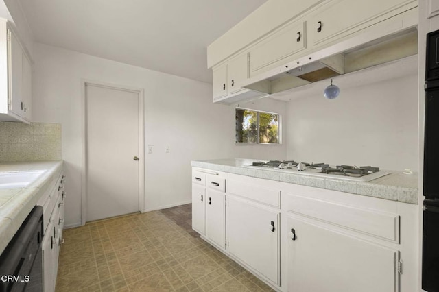 1543 Mobil Ave, Camarillo, CA 93010 - kitchen featuring white gas stovetop, black dishwasher, light countertops, and white cabinets