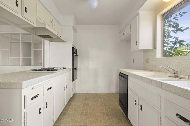1543 Mobil Ave, Camarillo, CA 93010 - kitchen featuring black appliances, light countertops, white cabinetry, and decorative backsplash