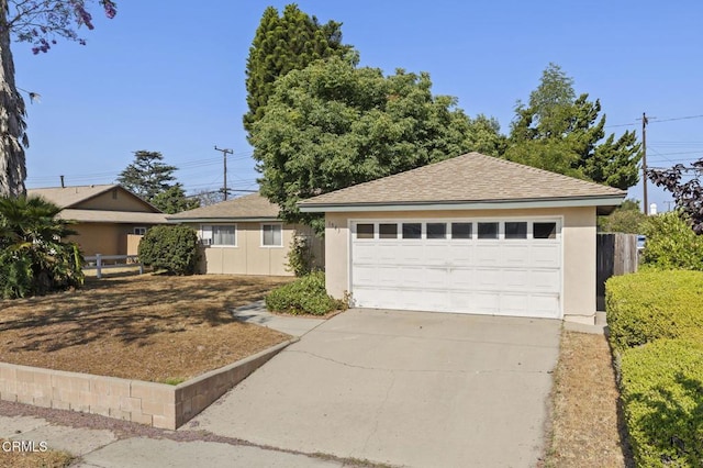 1543 Mobil Ave, Camarillo, CA 93010 - single story home featuring stucco siding, roof with shingles, an outbuilding, and a detached garage