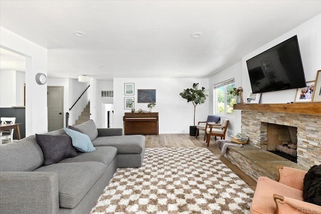 835 Minor Dr, Escondido, CA 92025 - living area with wood finished floors, stairs, and a stone fireplace