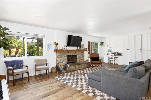 835 Minor Dr, Escondido, CA 92025 - living room with light wood-style flooring, a stone fireplace, and recessed lighting