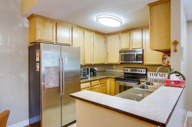 3635 Grove St Unit 268, Lemon Grove, CA 91945 - kitchen with stainless steel appliances, a peninsula, and light brown cabinetry