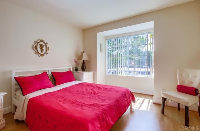 3635 Grove St Unit 268, Lemon Grove, CA 91945 - bedroom featuring wood finished floors and baseboards