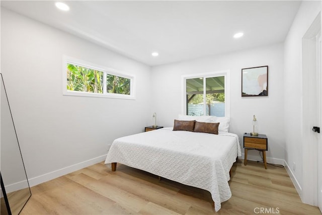 18746 Welby Way, Reseda, CA 91335 - bedroom featuring multiple windows, recessed lighting, and light wood-style floors