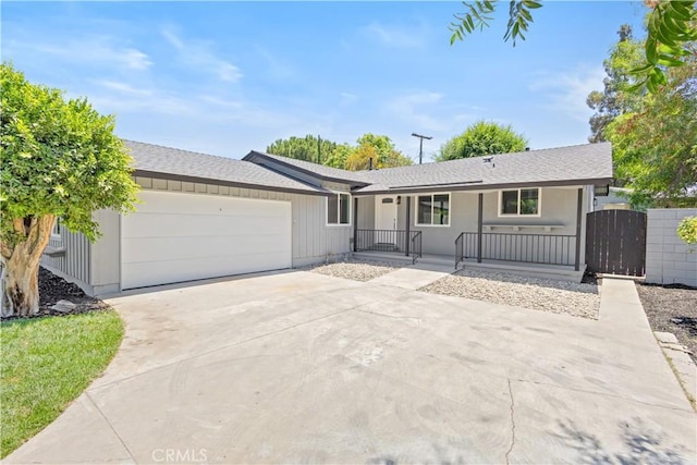 18746 Welby Way, Reseda, CA 91335 - single story home featuring covered porch, a garage, concrete driveway, a gate, and roof with shingles