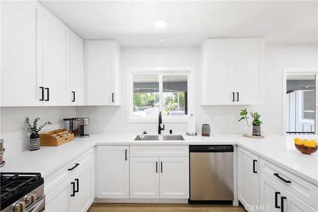 18746 Welby Way, Reseda, CA 91335 - kitchen with stainless steel appliances, white cabinets, light countertops, and recessed lighting