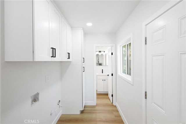 18746 Welby Way, Reseda, CA 91335 - laundry room with cabinet space, light wood-style floors, recessed lighting, hookup for a washing machine, and gas dryer hookup
