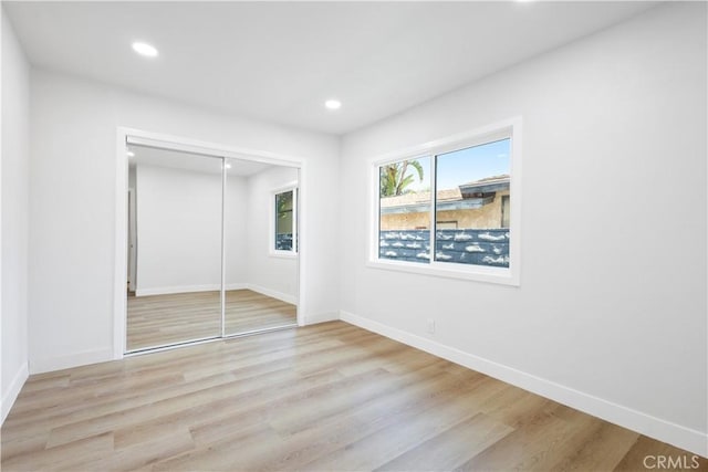 18746 Welby Way, Reseda, CA 91335 - unfurnished bedroom with light wood-style floors, a closet, and recessed lighting